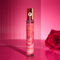 Adopt Absolument Rose perfume bottle with a rose design, featuring a red, white, and blue cap,