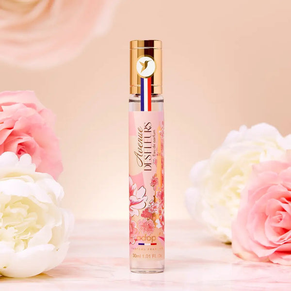 Adopt Avenue Des Fleurs Eau de Parfum in a clear bottle with a floral label and gold cap,