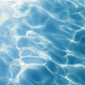 Adopt Blue Lagoon Body & Hair Mist, close-up of shimmering blue water, evoking a refreshing and aquatic sensation
