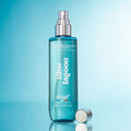 Adopt Blue Lagoon Body & Hair Mist in a blue bottle with a silver spray top and cap, front view