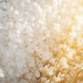 Adopt Flower Mania product image showing a close-up of white bath salts with delicate white flowers, highlighting texture