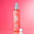 Adopt Fruit Shot Body & Hair Mist in a clear bottle with a silver spray top,