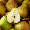 Adopt Hippie Mantra product image showing a close-up of a halved pear revealing its seeds, surrounded by whole pears