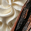 Adopt Lady Glitter product detail showing the texture of whipped cream with vanilla specks and a dark vanilla bean