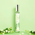 Adopt Muguet Coquet perfume bottle with a silver cap and lily of the valley design,