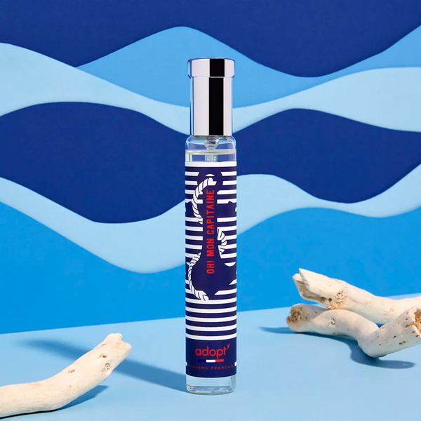 Adopt Oh Mon Capitaine fragrance bottle with a nautical design, featuring blue and white stripes and an anchor,