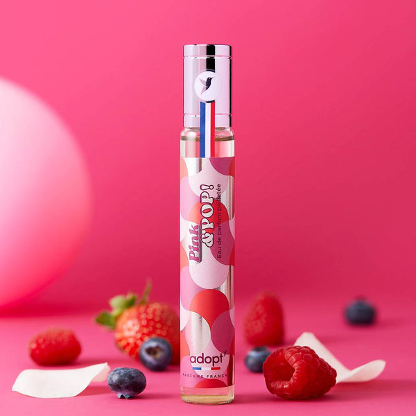 Adopt Pink And Pop perfume bottle with a pink and red polka dot design,