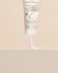 Embryolisse Mattifying Moisturizer tube dispensing a dollop of white cream onto a light surface, showcasing its texture