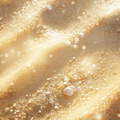 GD11 Repair Ampoule Program close-up showing the texture of fine sand with sparkling highlights and small white pebbles