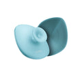 GESKE Body Brush 4-in-1 in a vibrant teal color, showcasing its textured silicone bristles on a white background