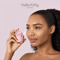 GESKE Facial Hydration Refresher 4 in 1 held by a woman, emitting a fine mist onto her face for skin hydration