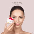 GESKE Hello Kitty Sonic Facial Brush 4 in 1 held by a woman, showcasing the product in a lifestyle context