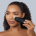GESKE MicroDermabrasion Blackhead Remover 7 in 1 in black, used by a woman on her nose for skin treatment