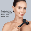 GESKE Sonic Facial & Body Roller in black, held by a woman on her shoulder, revitalizing skin for a toned look