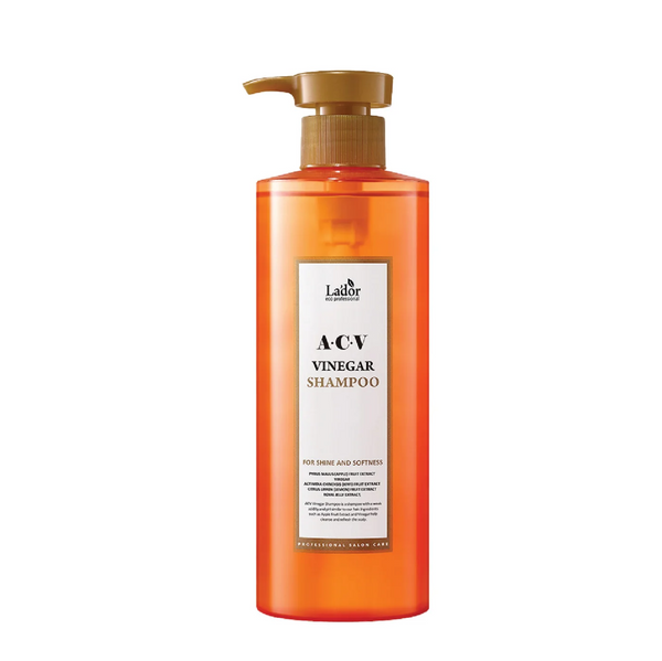 Lador ACV Vinegar Shampoo in an orange bottle with a pump dispenser, front view on a white background