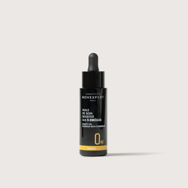 Novexpert Booster Serum with 5 Omegas, a beauty oil for skin, in a black dropper bottle on a white background