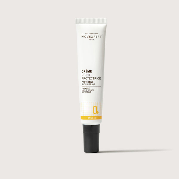 Novexpert Protective Rich Cream in a white tube with a black cap, front view on a white background