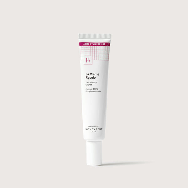 Novexpert The Repulp Cream in a white tube with a pink grid pattern and 'HA' logo, front view on a white background