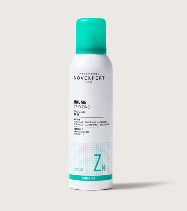 Novexpert Trio-zinc mist in a white bottle with a green cap, front view on a white background