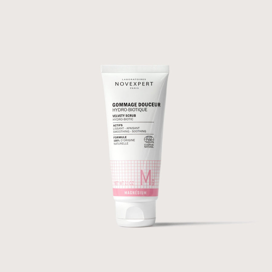 Novexpert Velvety Scrub Hydrobiotic with Magnesium, a smoothing and soothing scrub in a white tube on a white background
