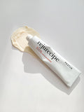 Pestlo Rejurecipe TXA Cream tube with a dollop of cream on a white background, showcasing its texture