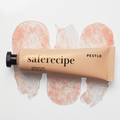 Pestlo Saferecipe Capsule Sun tube on a white background with product texture visible
