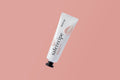 Pestlo Saferecipe Niamin C Tone-up Sun SPF 50+ PA++++ in a white tube with a drop of product, angled view